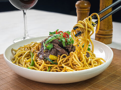 Beef noodles with vegetables and herbs