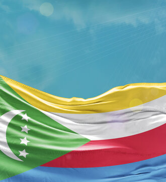 Comoros flag banner waving in the sky.