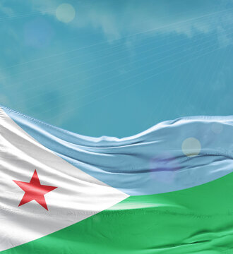 Djibouti flag banner waving in the sky.