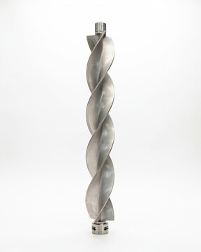 A stainless steel industrial auger screw drill bit standing vertically against a plain white background with component helical spiral design stands upright
