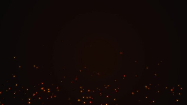 Bright orange glowing embers on a dark night background suitable for backgrounds, firerelated designs, warmth concept visuals, cozy atmospheres, and bonfire scenes.
