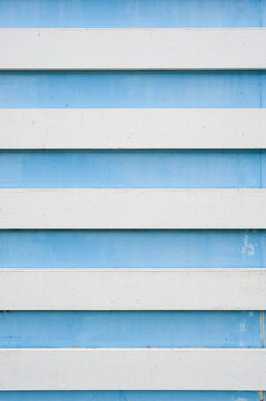 Light blue plastic horizontal blinds texture background close-up