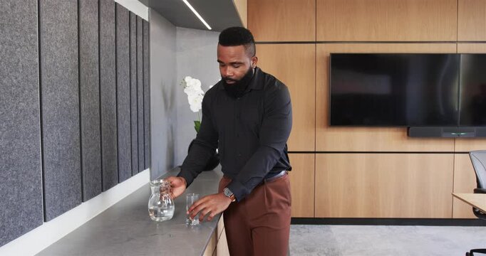 Lifestyle videos indoor of people doing activities at office, businessman holding glass of water, le