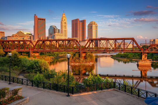 Columbus, Ohio, USA. Cityscape image of Columbus, Ohio, USA downtown skyline with the reflection of the city in the Scioto River at summer sunset.