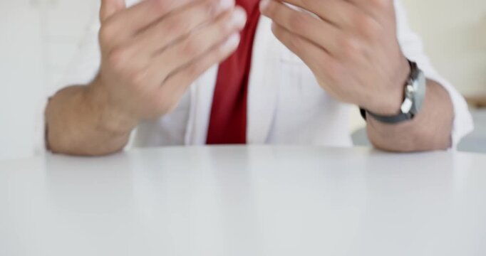 Close up of people talking to the camera, gesturing with hands, man wearing smartwatch sitting at ta
