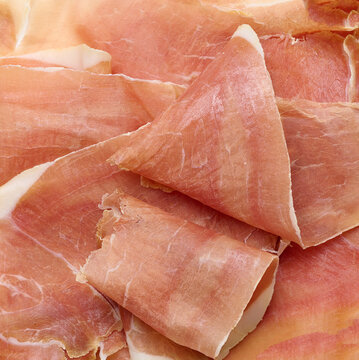 Thinly sliced dry-cured jamon or prosciutto ham.