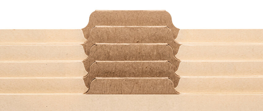 Craft paper file folder tabs stacked in office archive filing system for document organization, index category sorting, business administration record keeping, isolated on black background.