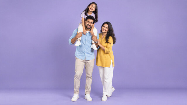 Happy Indian Family Portrait With Parents and Daughter on Purple Background