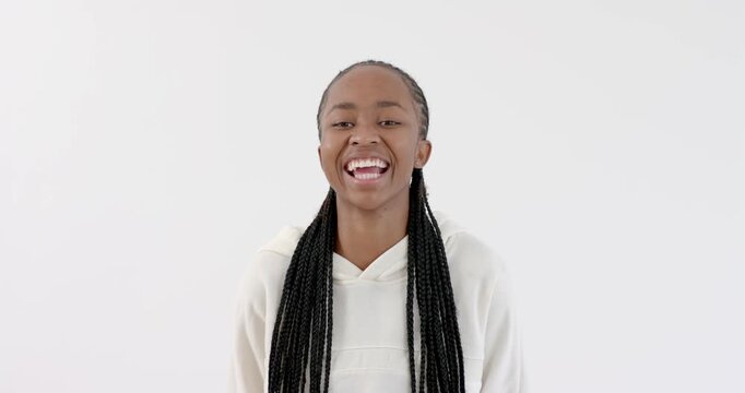High speed photography for dynamic scenes, Smiling woman in white hoodie with braided hair looking.