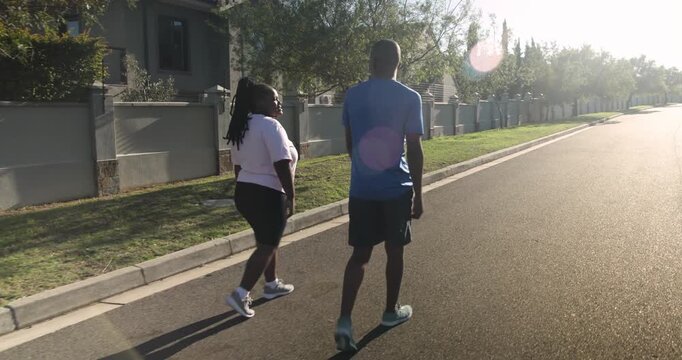 Lifestyle videos outdoor of people doing activities, jogging in neighborhood, two friends exercising