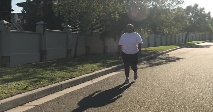 Lifestyle videos outdoor of people doing activities, walking on suburban street, woman exercising ou
