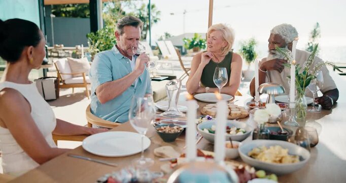Friends, talk and drink wine on patio with lunch, summer holiday and get together for weekend break. Happy, mature people and smell alcohol outdoor in backyard with food, hangout or social connection