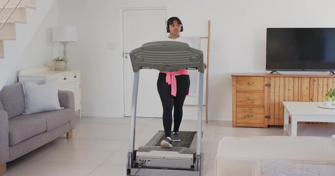 Lifestyle videos indoor of people doing activities at home, walking on treadmill at home, woman list