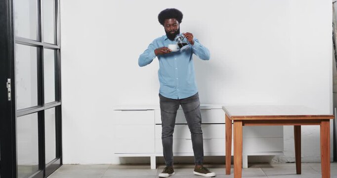 Lifestyle videos indoor of people doing activities at office, man standing in modern office space wi