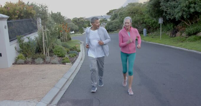 Lifestyle videos outdoor of people doing activities, jogging together, elderly couple enjoying exerc