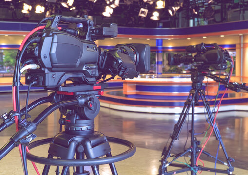 Professional Broadcast Video Cameras Set Up In Modern Television News Studio
