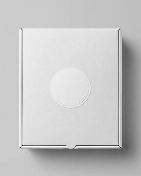 Top view of blank white closed cardboard box with circular empty logo area on plain gray background for packaging branding mockup concept