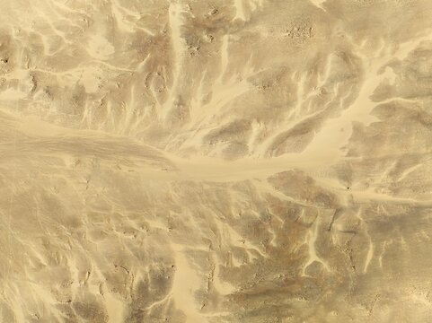 Sand patterns caused by continuous wind. Aerial view. Drone shot. Namib Desert, Skeleton Coast, Namibia