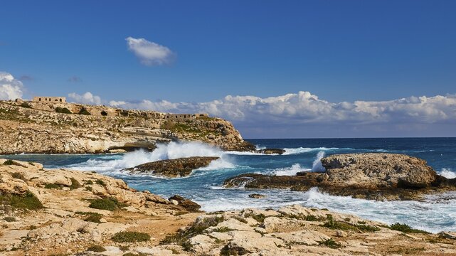 Rocky coast, ruins of houses on rocks, strong surf, rocks in the sea, bay, Mare Morto, Lampedusa Island, Agrigento Province, Pelagic Islands, Sicily, Italy