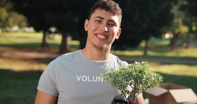 Park, volunteering and man with plants for nature restoration, eco advocate or gardening initiative. Portrait, sustainable environment project and person with trees for climate action, outdoor or ngo