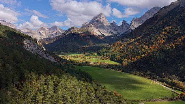 Aerial view over La Jarjatte Valley in autumn, with mountain peaks of the Devoluy Massif. Vercors Regional Natural Park, Drome, France