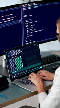 Software Developer Carefully Writes Code