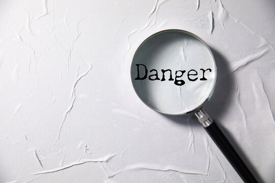 Danger word written on paper
