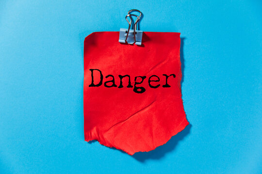 Danger word written on paper