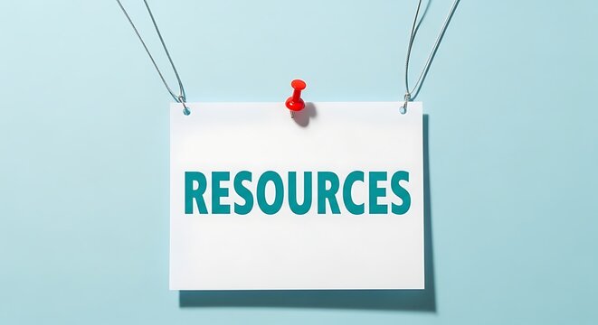Resources word sign pinned to a bright blue wall background