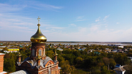 Aerial View of Golden Dome and Cross of Red Brick Orthodox Church © Andrey