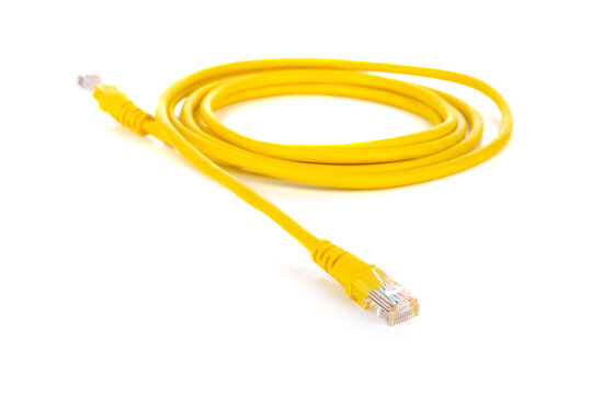 A coiled yellow ethernet network cable with connectors on a white background lan cable technology background cable cord
