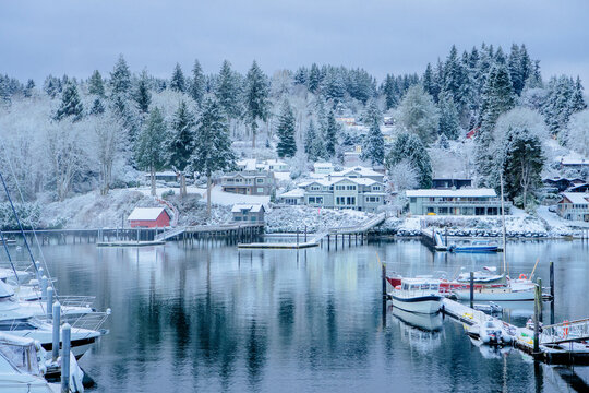 Snow-covered marina with boats and docks in WA, USA winter