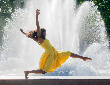 South Asian woman leaping gracefully