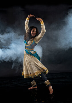 South Asian female dancer performing indian classical dance