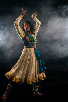 South Asian woman performs classical indian dance