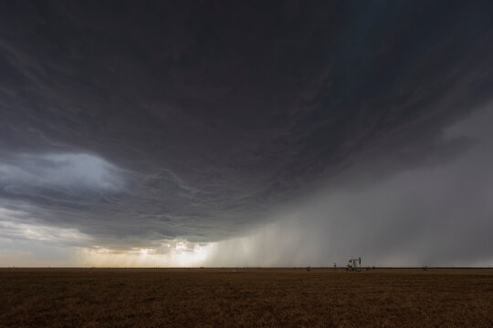 Supercell thunderstorm forming over oil fields in morton, texas