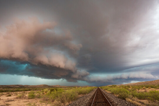 Railway tracks under storm clouds in sanderson, texas Great Plains