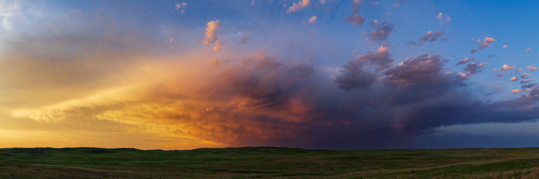 Prairie Sunset with storm clouds over nebraska sandhills landscape