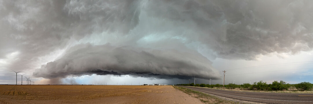 Supercell thunderstorm over wind farm near garden city, texas