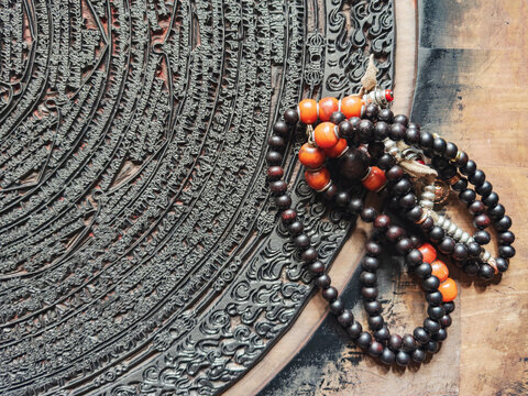 Intricately carved Corcular Printing Block with tibetan prayer beads