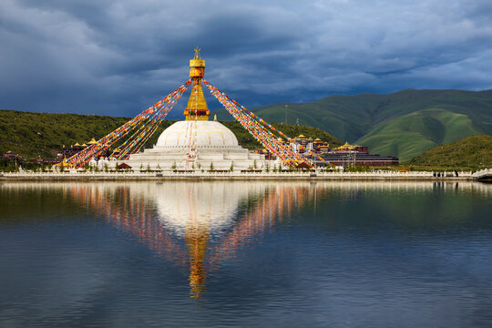 Stupa at Zhuqing Wujian Zen Forest Monastery with prayer flags