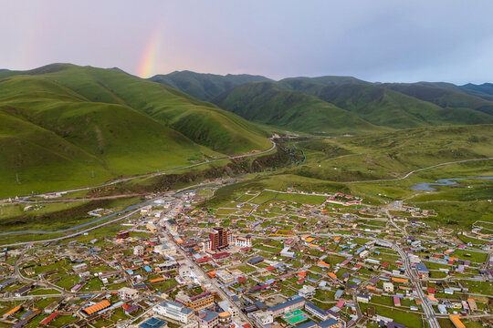 Zhuqing village in green mountains with Sunset rainbow
