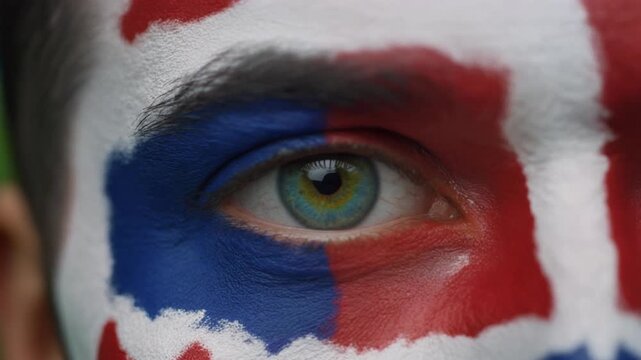 Extreme macro photorealistic footage of a fictional adult male football supporter's eye, vivid green iris with England flag face paint