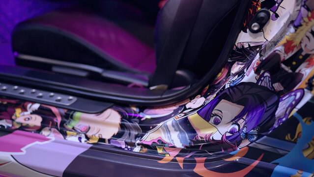 Car wrapped itasha with anime characters from Demon Slayer at car exhibition