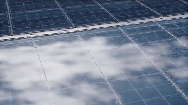 Cloud reflection moving across a solar module