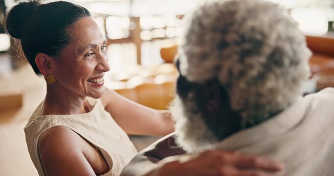 Laugh, relax and couple on sofa for conversation, talking and chat for bonding, love and marriage. Home, happy and mature man and woman on couch for connection, commitment or interracial relationship