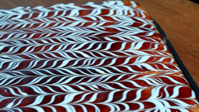 4K Cinematic Chocolate Cake with Elegant White Icing Pattern and Glossy Dessert Texture