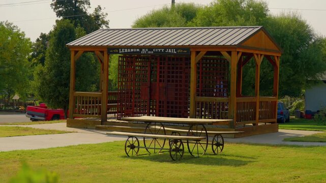 Historic open air city jail gazebo on a small town green