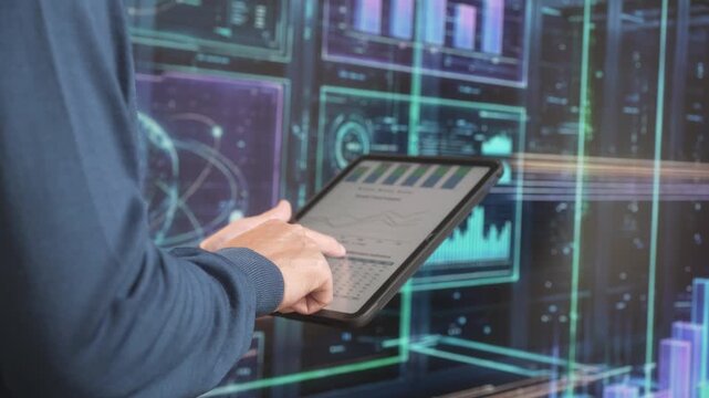 Close-up of a person using a tablet with data charts against glowing digital screens, showing business analytic, technology, and insecurity work.