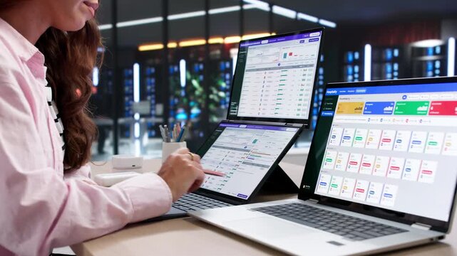 Business Analyst Reviewing Interactive Dashboards On Laptop